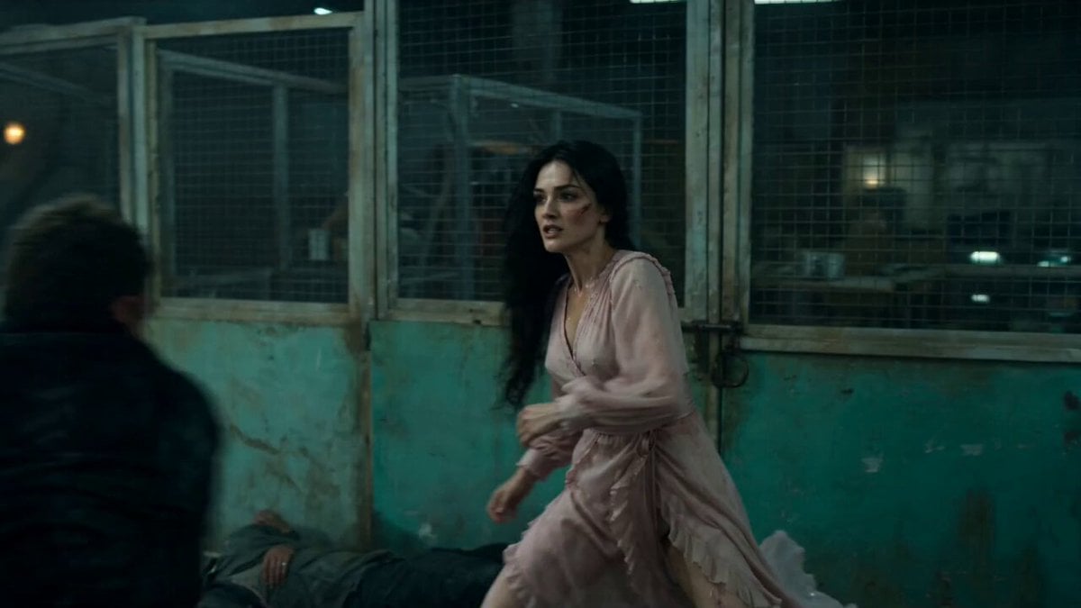 A cinematic, high-intensity fight sequence in a dark, gritty…
