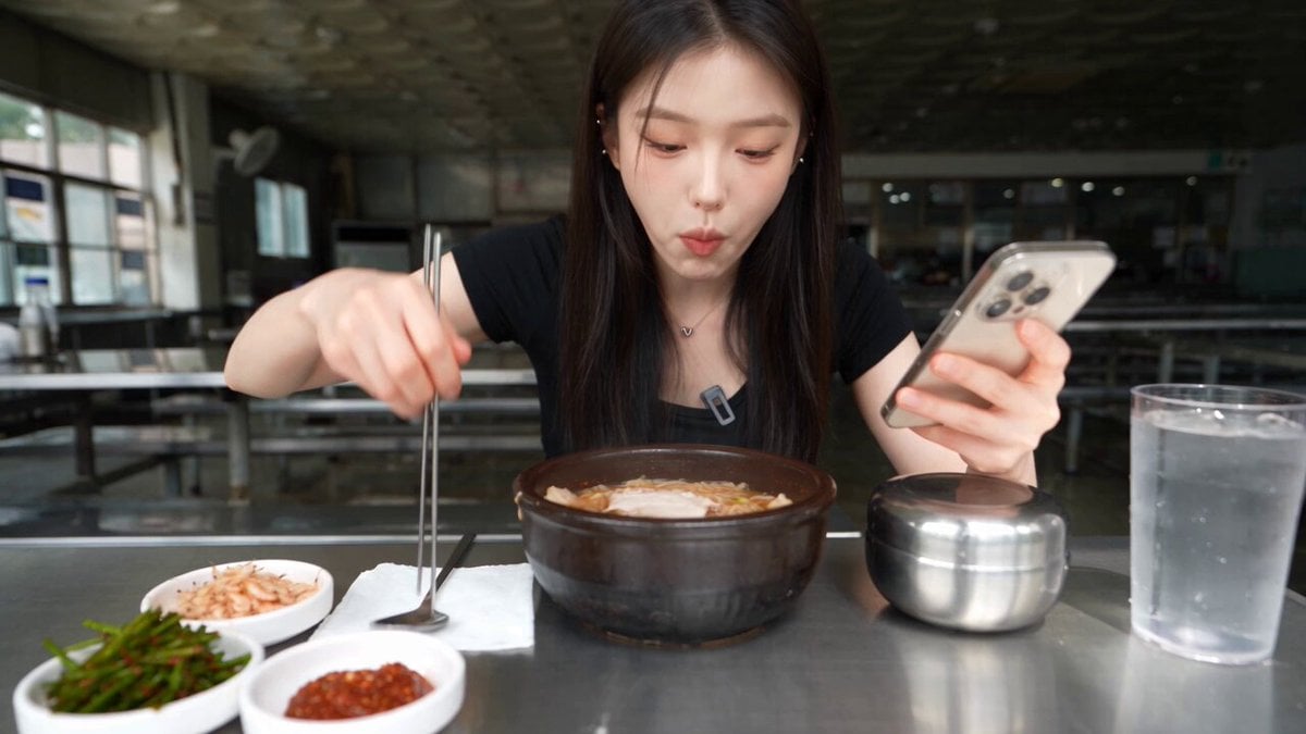 A single woman eats Korean pork-and-rice soup alone in…