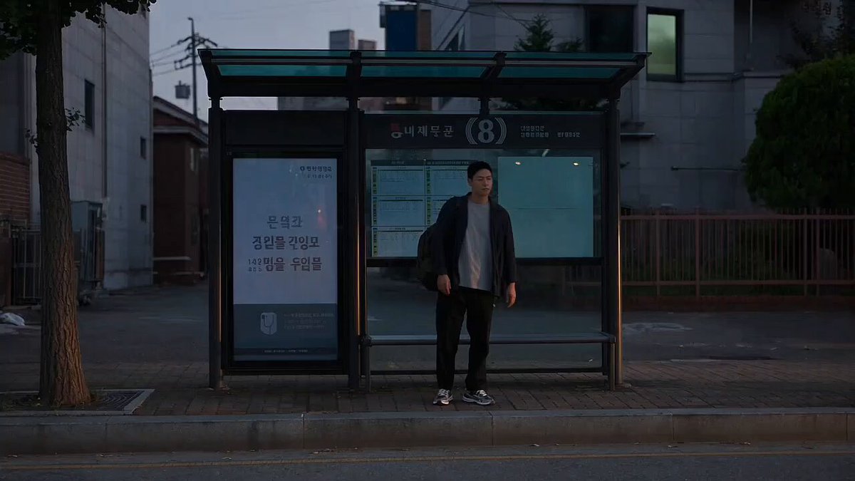 Photorealistic live-action Korean city scene at dusk, with exactly…