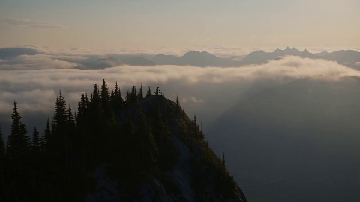 A hyper-realistic, ultra-cinematic 30-second mountain biking film shot on…