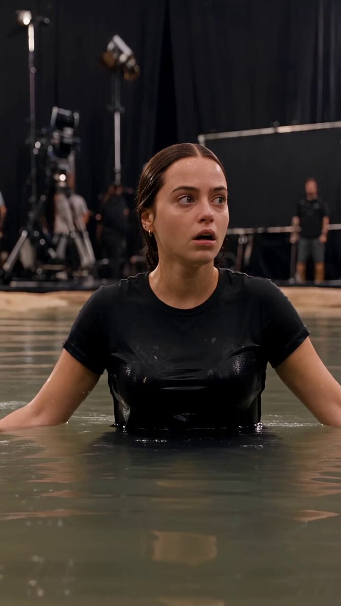 A terrified young woman trapped in deep water as…